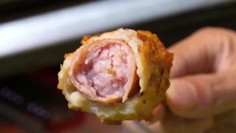 Close up of Korean Fish Cake Hot Bar with Sausage Filling on Stick Stock Footage 337374554