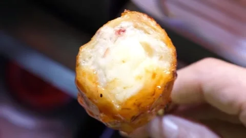 Close up of Korean fish cake skewer with spicy gochujang sauce glaze, traditiona Stockbeeldmateriaal 337374563