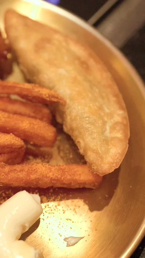 Close Up of Korean Fried Chicken Mandu and Fries on Brass Plate Stock Footage 340194566