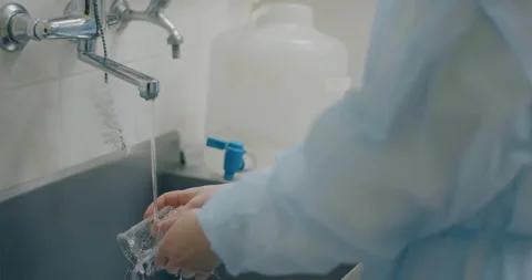 Close-up of Lab Technician Washing Test Tubes Stock Footage 318596292