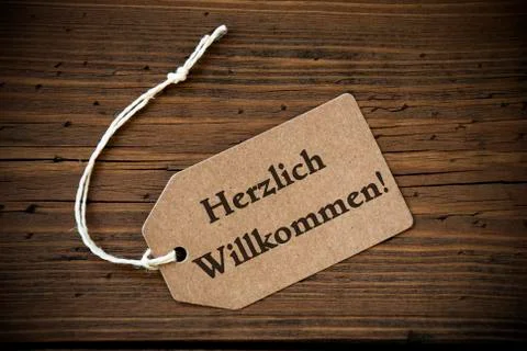 Close Up Of Label With German Text Herzlich Willkommen Stock Photos