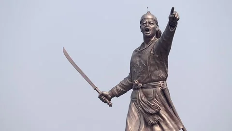Close-up of Lachit Borphukan statue holding sword and pointing Stock Footage 332612855