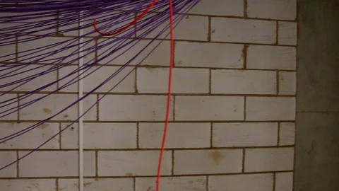 Close up of ladder and electrical cables hanging down in new build Stock Footage 112615048