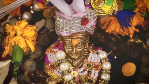 Close-Up of Laddu Gopal Idol with Decorative Ornaments Stock Footage 316895046