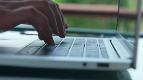 Close-up of ladies' hands that fluently type on a laptop while pressing hard Video stock 234020852