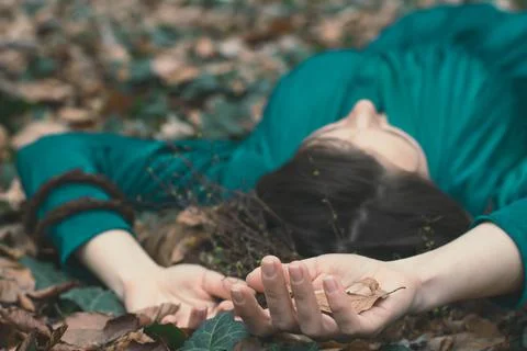 Close up lady lying on ground concept photo Foto stock