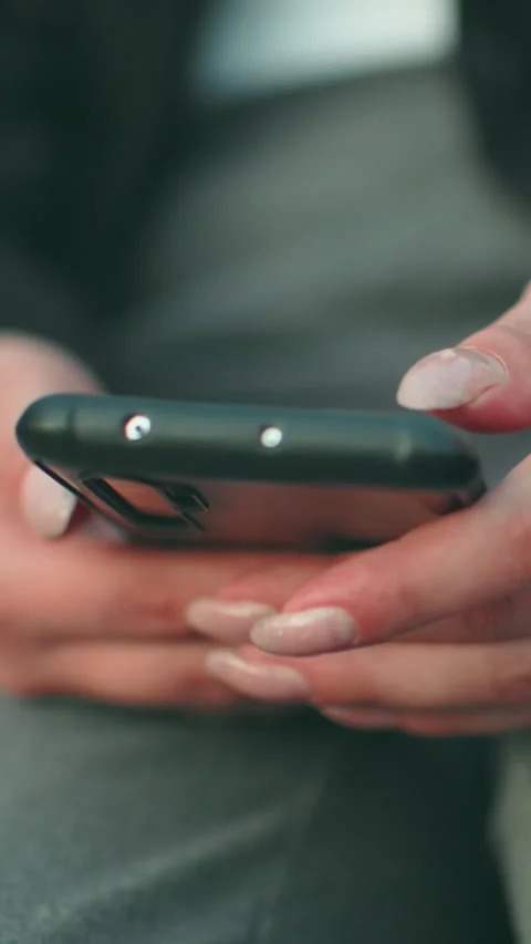 Close Up of Lady Operating Phone with Artificial Nails and Bokeh City Lights Stock Footage 319756105