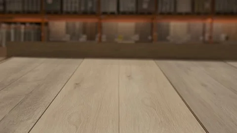 Close up laminate flooring as camera pulls back revealing large home improvement Stock Footage 321710650