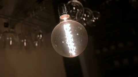 Close up of a lamp in a cafe. The staff behind the bar in the background Stock Footage 96201046