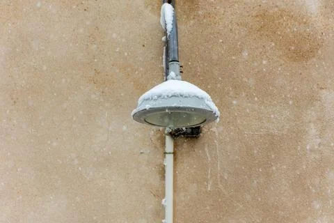 Close up of lamppost covered with snow. Stock Photos