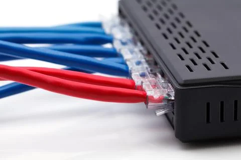 Close up lan network switch with ethernet cables plugged in 库存照片