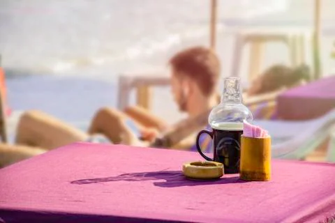 Close up lantern lamp on the table beside the beach, Atmosphere of the sea be Stock Photos