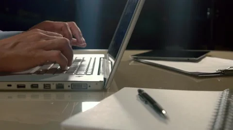 Close-up of lap-top computer and a man typing something on it Stock-Footage 68712743
