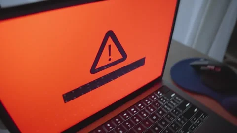 Close up on laptop computer displaying warning message of cyber virus infection Video stock 342512301
