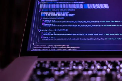 Close up laptop computer screen with a programming code creating Stockfoto's