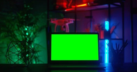 Close up of the laptop computer on the table in the darkness and interior of the Stock Footage 104983052