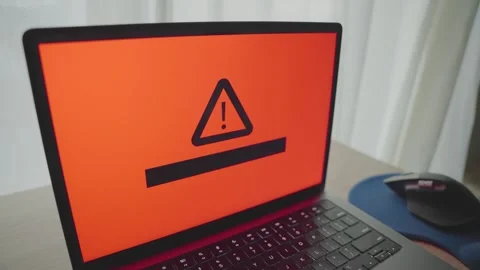 Close up on laptop glitching and message warning of potential virus infection Stock Footage 344231560