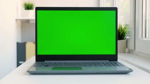 Close up laptop green screen. Chroma key green screen computer set up for work Stock Footage 158799203