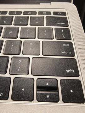 Close-Up Laptop Keyboard With Delete Enter Shift And Arrow Keys For Productivity 写真素材