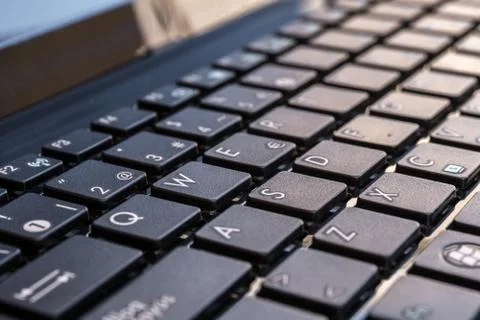 Close-up of laptop keyboard focus on button Stock Photos