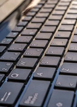 Close-up of laptop keyboard focus on button Stock Photos
