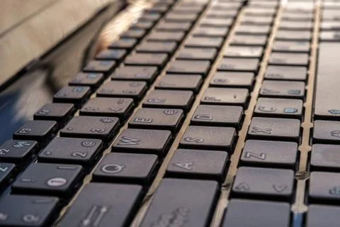 Close-up of laptop keyboard focus on button Stock Photos