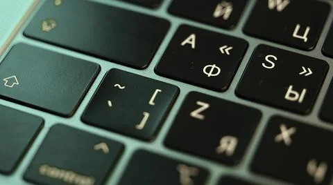 Close up of laptop or computer keyboard. Action. Concept of modern devices and Stock Photos