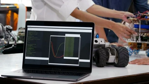 Close up of laptop running source code on screen at laboratory. Stock Footage 94736904