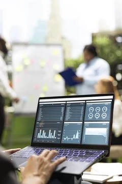 Close up of laptop screen displaying charts and performance dashboards Stock Photos