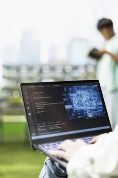 Close-up of laptop screen shows artificial intelligence and binary code Foto stock