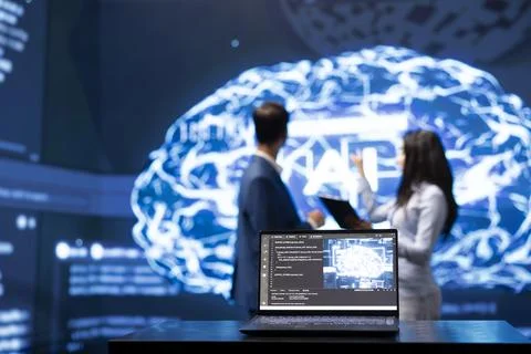 Close up of laptop used by employees developing AI systems in tech startup Stock Photos