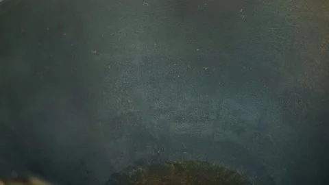 Close-up of large cauldron for pilaf with boiling oil Stock Footage 346539401