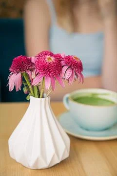 Close-up, a large ceramic cup with a green matcha drink on a wooden table. Stock Photos
