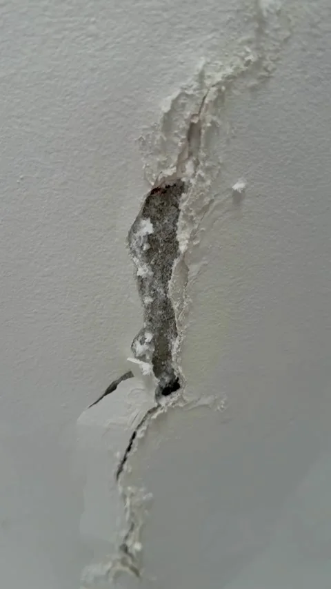 Close up of a large crack in white wall Video stock 331982142