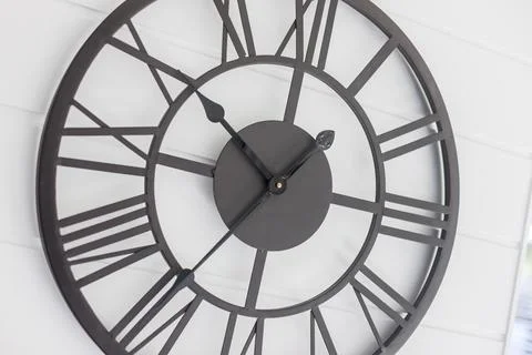 Close up of a Large Designer Wall Clock Placed Outside a Kitchen Area Stock Photos
