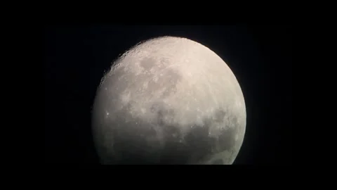 Close-up of a large full moon in a telescope lens against a black night sky. Stock-Footage 327864774