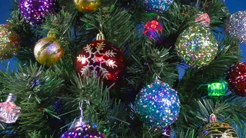 Close-up of a large green Christmas tree with multi-colored tints Stock Footage 166703081