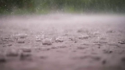 Close-up, large, heavy drops of rain, rainfall, shower, fall with a spray, Water Video stock 90871395