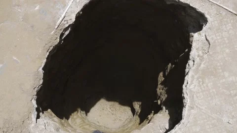 Close-up of a large hole made in a house to make a floor study Stock Footage 150671065