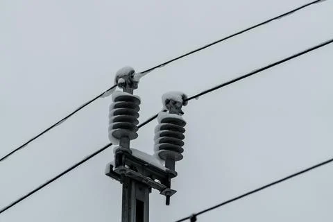 Close up of a large isolator on a power line for electric passenger trains. 스톡 사진