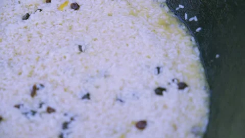 Close Up of Large Kazan Pot of Pilaf with Meat, Rice and Raisins 스톡 동영상 346579264