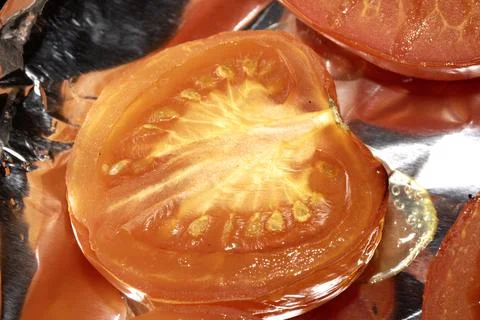 Close up of large red roasted tomatoes just cooked Stock Photos