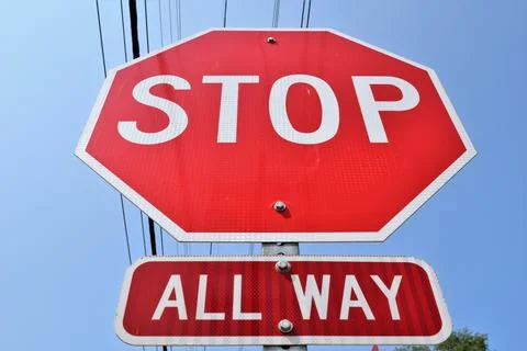 Close up of Large Red Stop Sign and "All Way" Sign Underneath Stock Photos