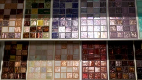 Close-up of a large selection of ceramic mosaic tile samples in the home decorat Stock Footage 123296444