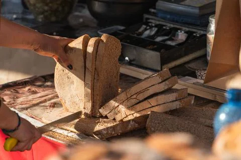 Close-up of large slices of gray bread cut with a large bread knife Stock Photos