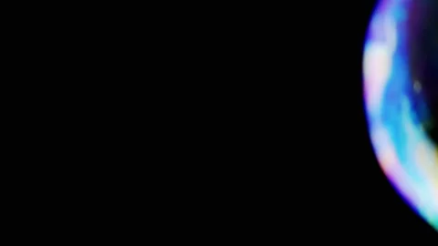 Close up, Large Soap Bubbles Slowly Fly on a Black Background 動画素材 246141208