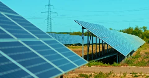 Close-up, large solar panels stand outdoors in a field, modern power plant Stock Footage 139425663