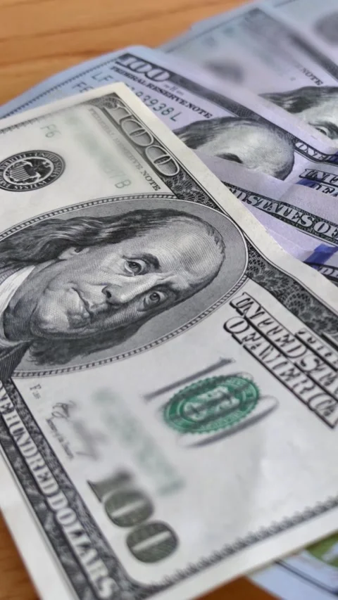 Close Up of a Large Stack of One Hundred Dollar Bills - Vertical 4K Stock Footage 285345669