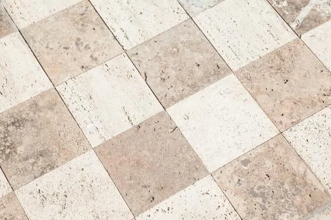 Close up of a large stone tile floor into the distance Stock Photos