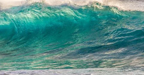 Close Up of Large Turquoise Ocean Wave Wall Texture and Ripple Patterns Stock Photos